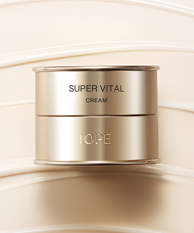 IOPE Super Vital Cream 50ml luxury skincare product in gold packaging on a cream background