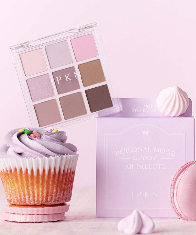 IPKN Personal Mood All Palette Cool Pressed 6.8g eyeshadow set displayed with pastel macarons and cupcake