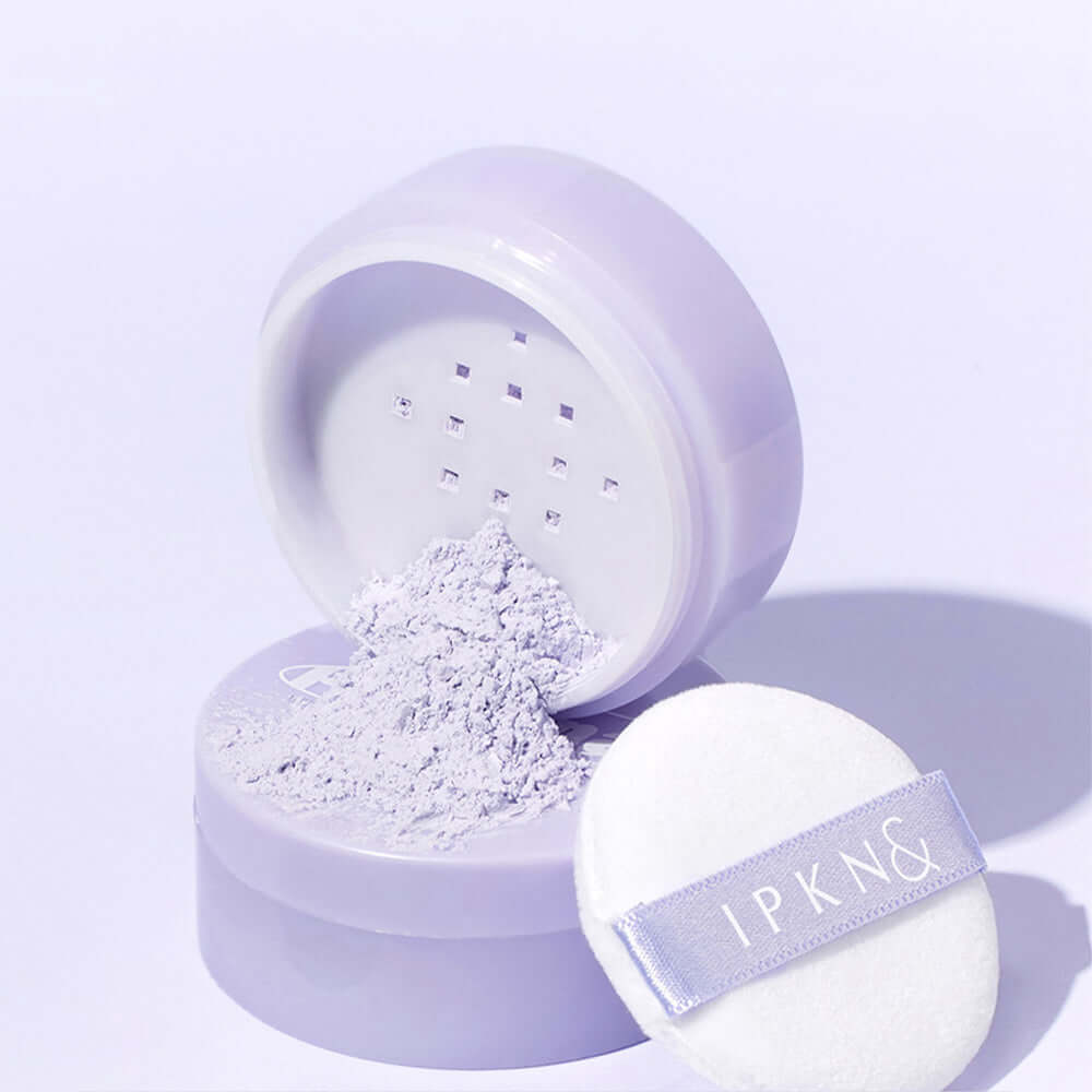 IPKN Personal Tone Correcting Powder (Lavender) with puff in open lavender packaging, perfect for color correction and smooth finish.