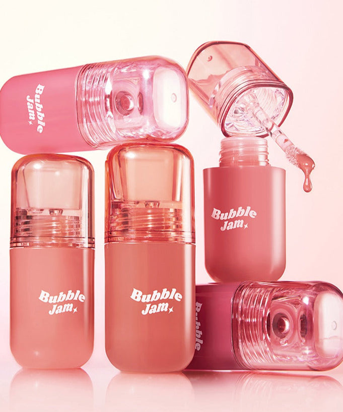 IPKN Bubble Jam Gloss bottles in pink, showcasing vibrant lip gloss colors for a glossy finish.