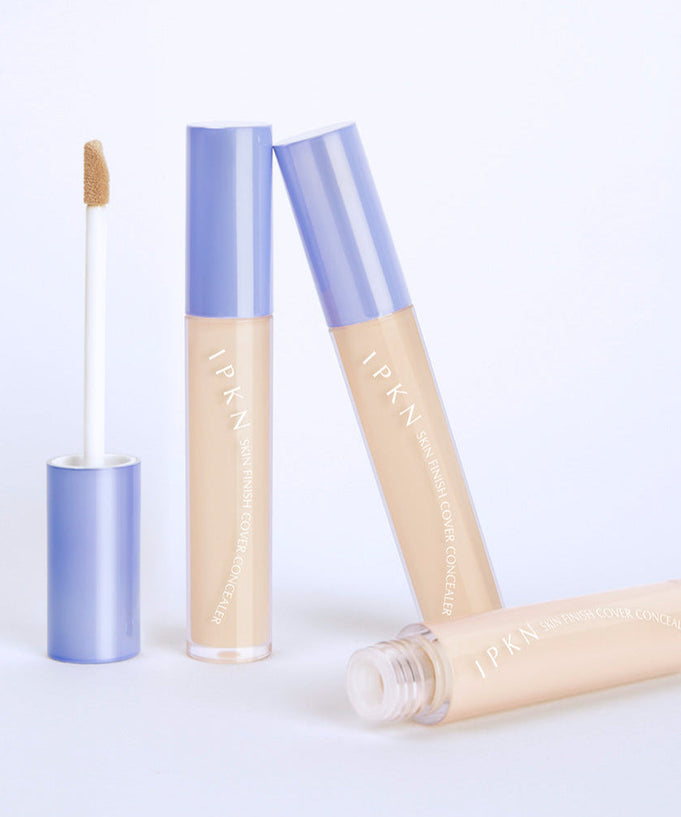 IPKN Skin Finish Cover Concealer SPF30 PA++ shown with open and closed tubes for skin coverage and sun protection.