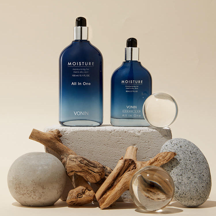 ISAKNOX Bonin All-in-One Moisture 150ml + 80ml product shot for men by Gentleman Korea, two blue bottles styled with natural props