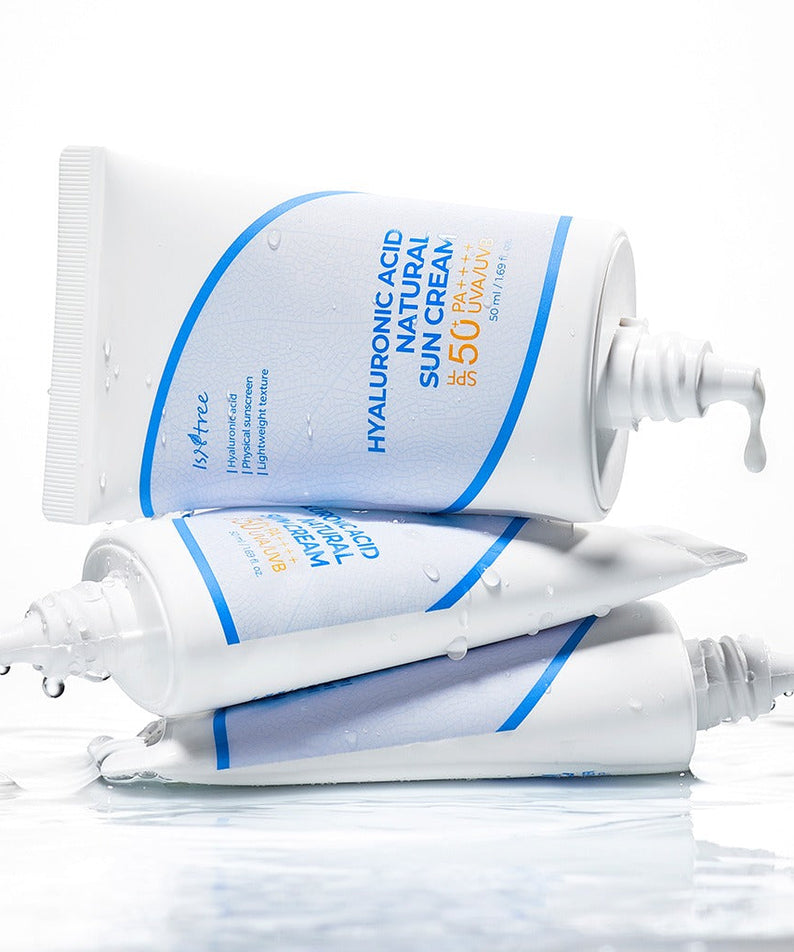 ISNTREE Hyaluronic Acid Batural Sunscreen 50ml tubes stacked with water droplets, highlighting the hydrating sunscreen's packaging.
