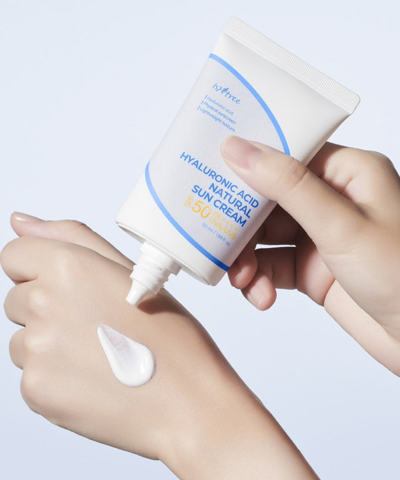 Applying ISNTREE Hyaluronic Acid Batural Sunscreen 50ml on skin for sun protection and hydration.