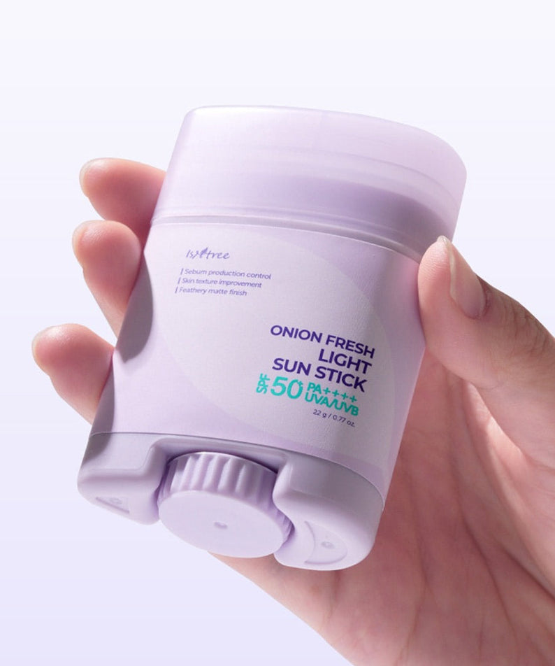 ISNTREE Onion Fresh Light Sun Stick 22g in hand, SPF 50 sun protection skincare.