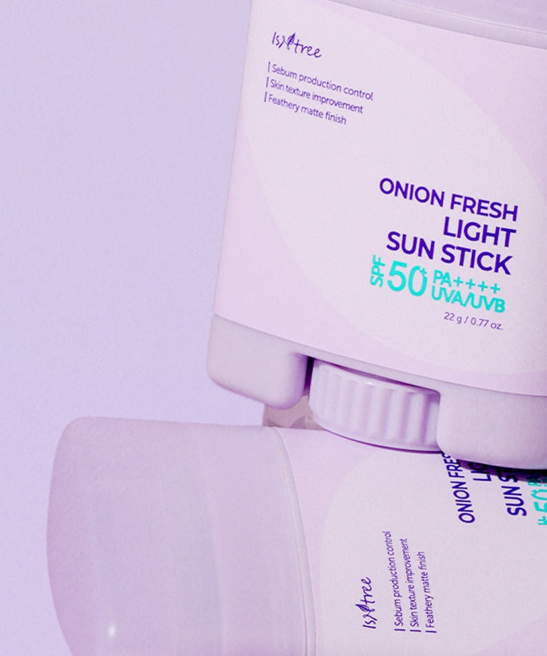 ISNTREE Onion Fresh Light Sun Stick 22g with SPF 50 displayed on a purple background.