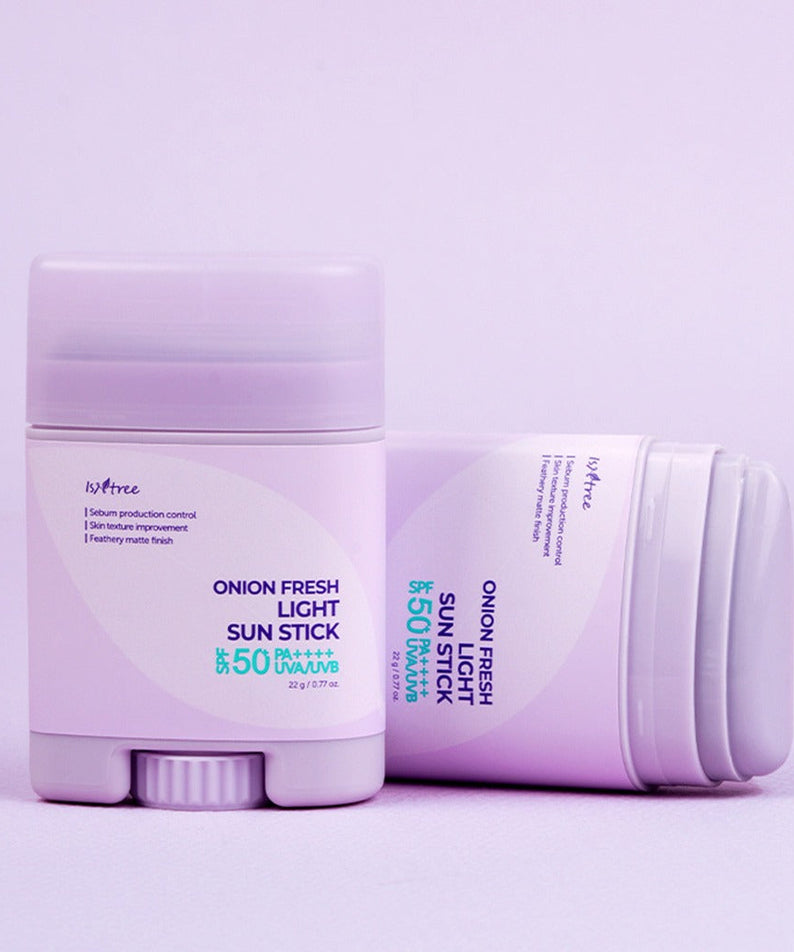 ISNTREE Onion Fresh Light Sun Stick 22g - SPF 50+ sunscreen, moisturizing and protective formula, image of product packaging in lavender.