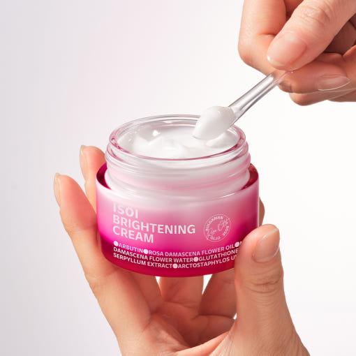 Hands holding and applying ISOI Brightening Cream 55ml
