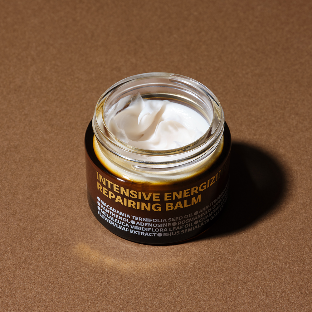 ISOI Intensive Energizing Repairing Balm 50ml in an open jar on a brown surface