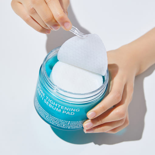 ISOI Pore Tightening Anti-Sebum Pads 60 Sheets being opened by hand