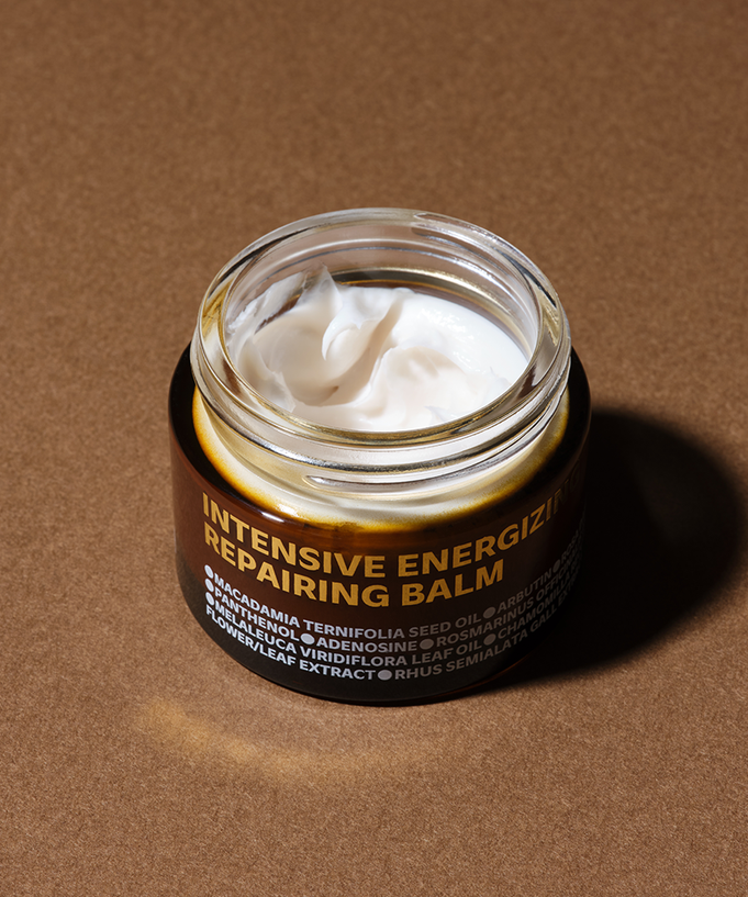 ISOI Intensive Energizing Repairing Balm 50ml in an open jar on a brown surface