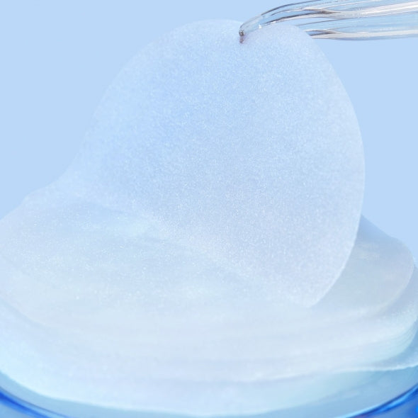 Close-up of IT'S SKIN Power 10 Licorice Julen Jelly Pad 130 Sheets showing a translucent pad being lifted with tweezers.