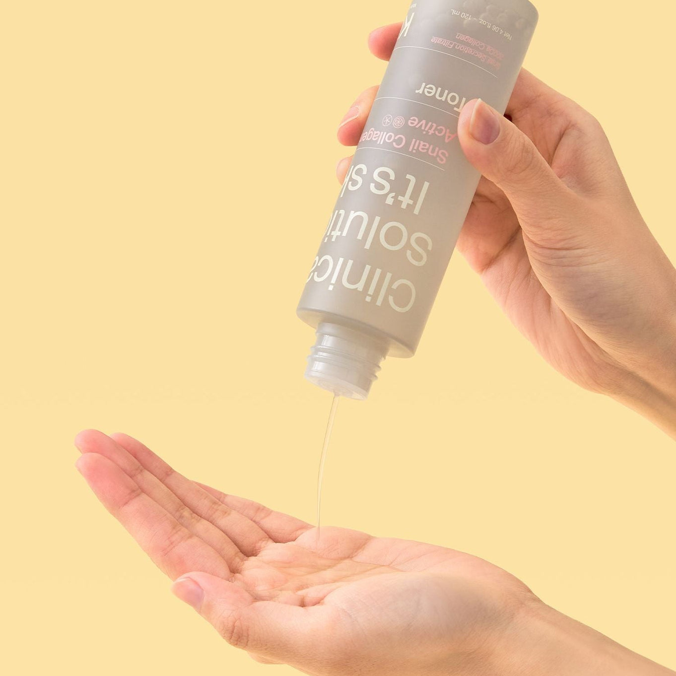 Person pouring IT'S SKIN Snail Collagen Active Toner 120ml into hand on a yellow background.