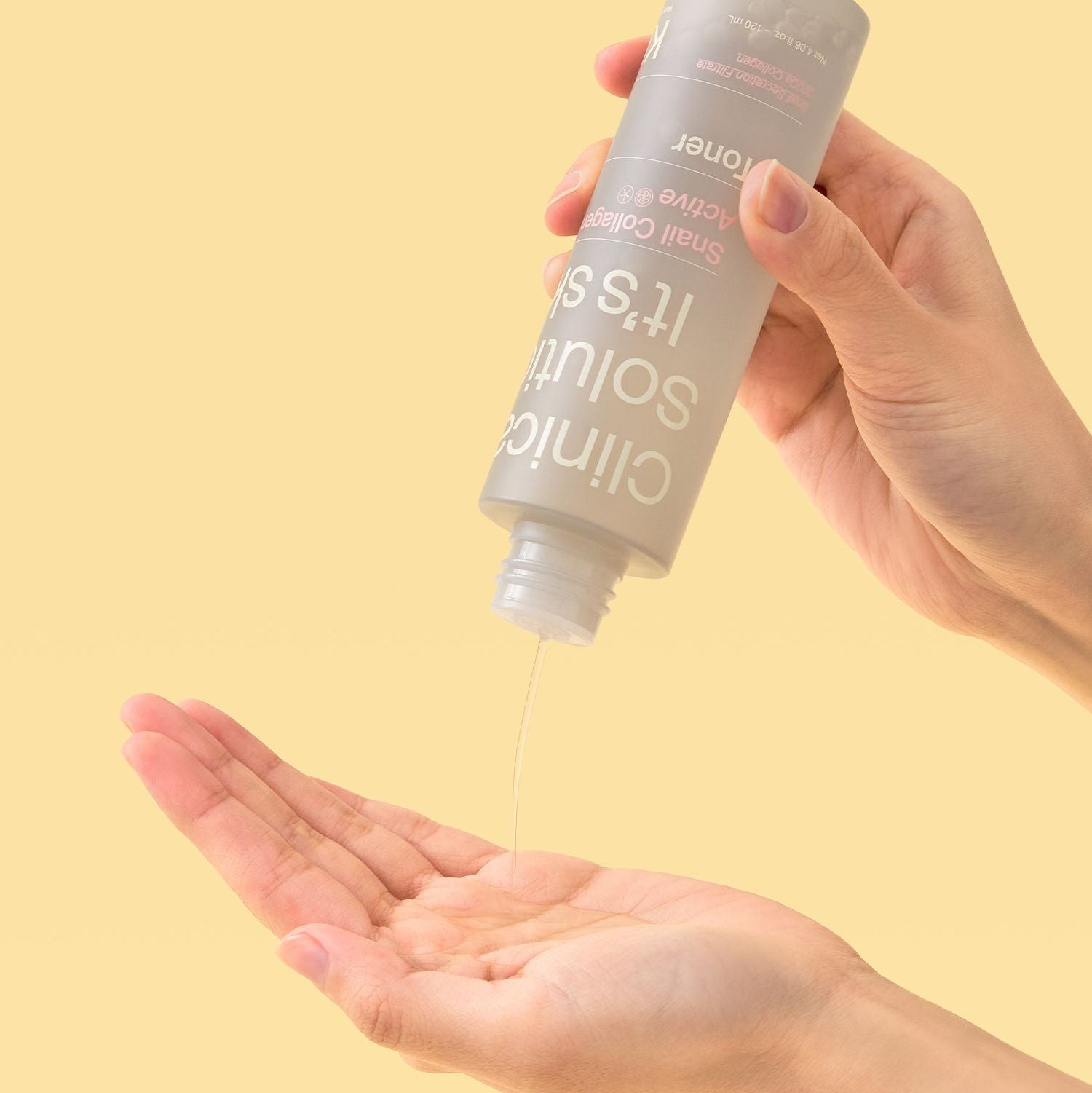 Person pouring IT'S SKIN Snail Collagen Active Toner 120ml into hand on a yellow background.