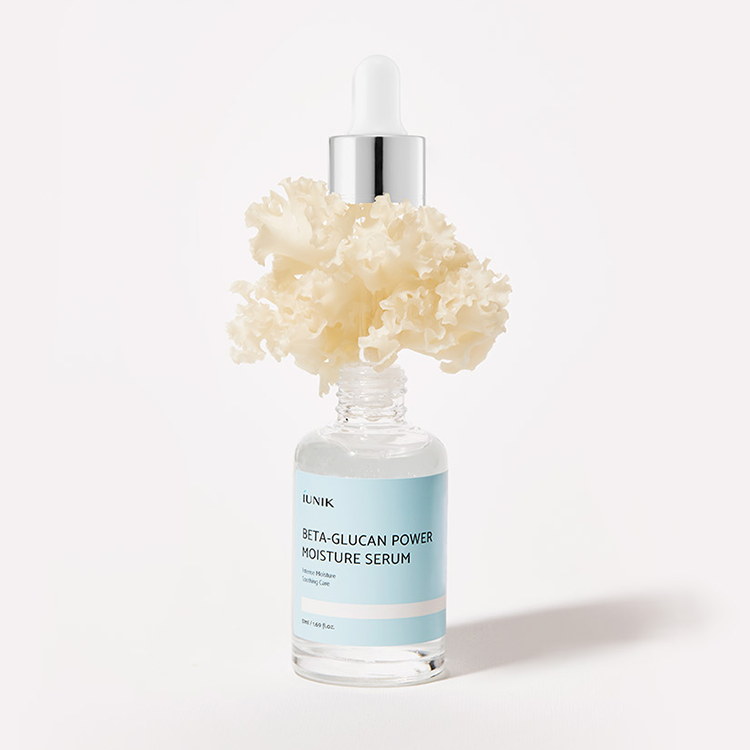 IUNIK Beta Glucan Power Moisture Serum 50ml bottle with natural ingredients background.