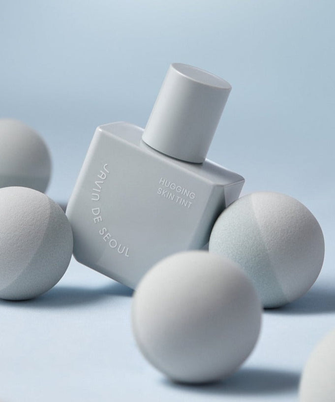 JAVIN DE SEOUL Hugging Skin Tint Tone-Up Base 55g with elegant packaging and soft tone-up effect.