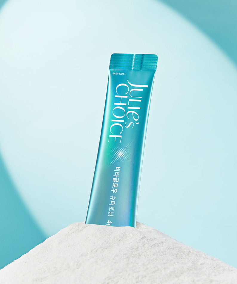 JULIE'S CHOICE Vita Glow Super Toning product packaging displayed on white surface against blue background.