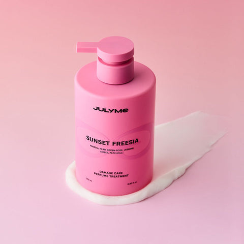 JULYME Damage Care Perfume Hair Treatment 500ml bottle on pink background
