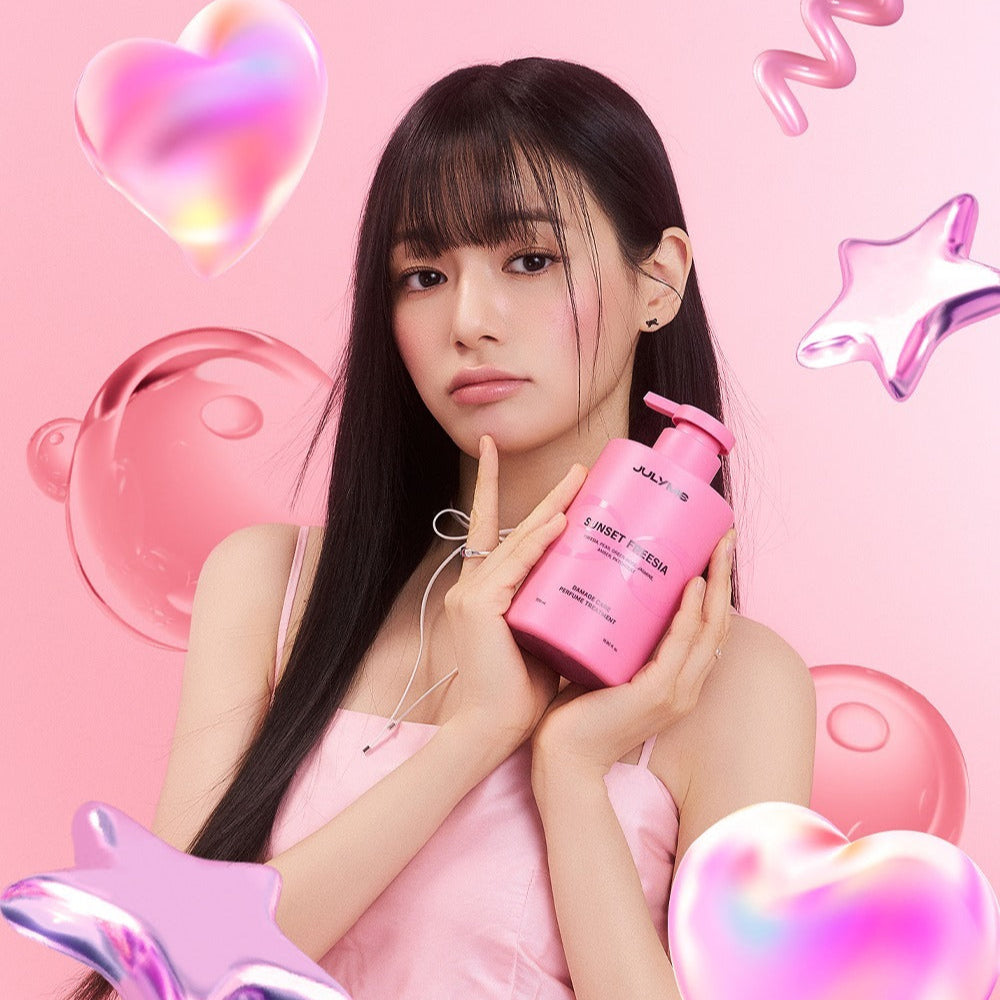 Woman holding JULYME Damage Care Perfume Hair Treatment 500ml with pink hearts and stars background