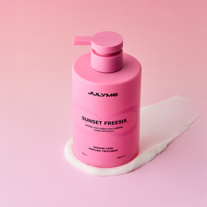 JULYME Damage Care Collagen Treatment 500ml (Sunset Freesia) in a pink bottle against a gradient background