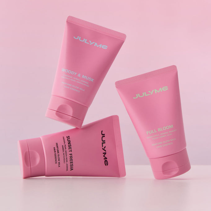 JULYME Perfume Glow Milk Hair Essence 80ml (Woody& Musk) in pink packaging, showcasing luxurious hair care with woody and musk scent.