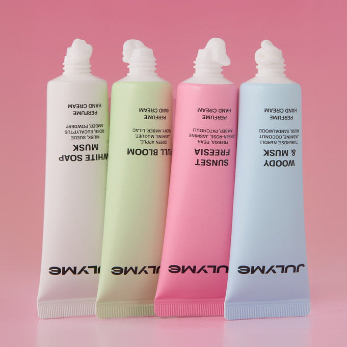 JULYME Perfume Shea Butter Hand Cream 30ml tubes in assorted colors on pink gradient background