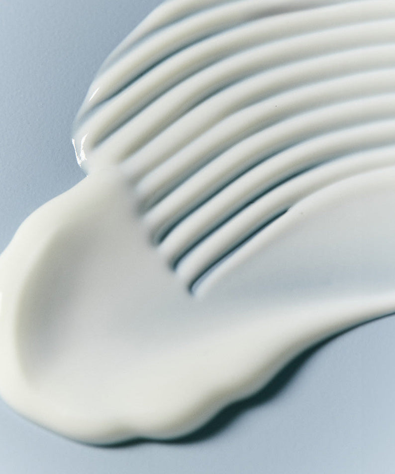 Texture of JUMISO Hyaluronic Acid Water Plumping Moisture Sun Serum 40ml on a smooth surface