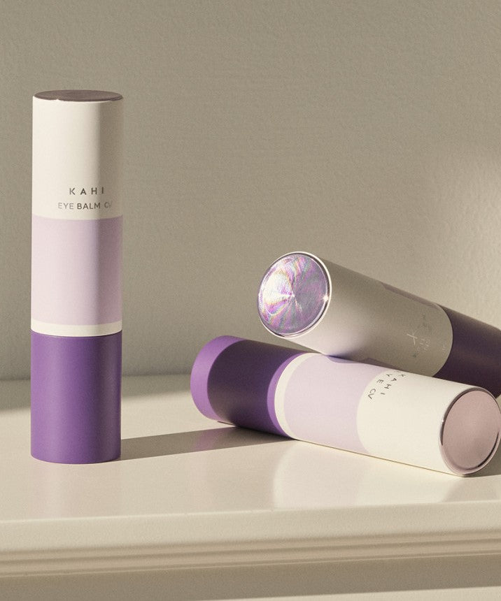 KAHI Eye Balm CV 9g products displayed on a white surface under soft lighting.