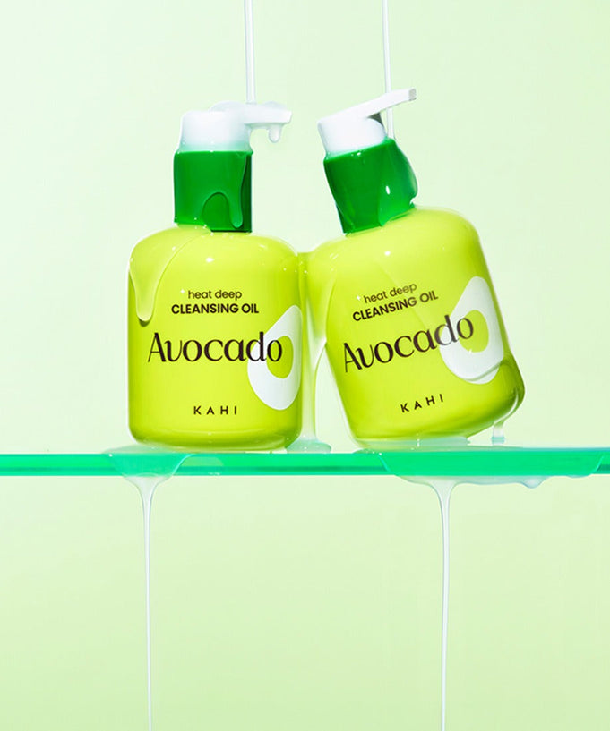 KAHI Heat Deep Cleansing Oil 200ml in green avocado packaging with pumps, displayed against a light green backdrop.