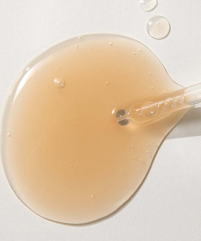 KAINE Kombu Barrier Ampoule serum texture with dropper, showcasing rich formulation for skincare benefits.