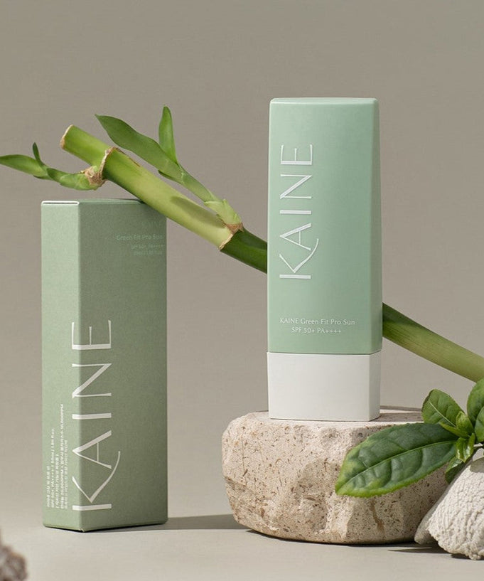 KAINE Green Fit Pro Sun cream 55ml displayed with bamboo and green leaves.