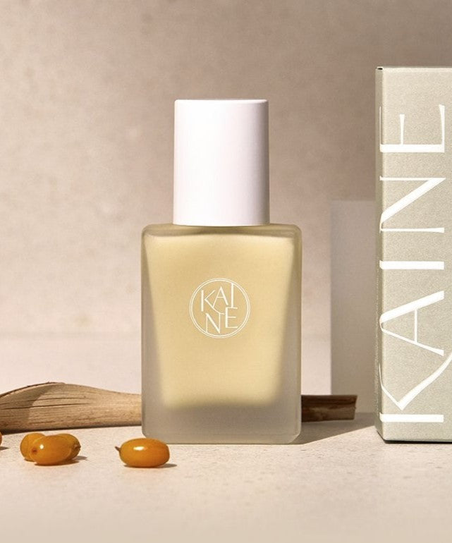 KAINE Vita Drop Serum 30ml bottle displayed with box and sea buckthorn berries
