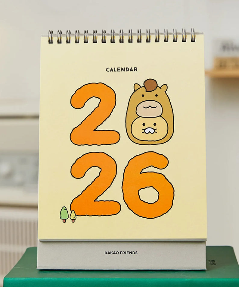 KAKAO FRIENDS Desk Calendar 2026 with cute character design shown on a desk setting.