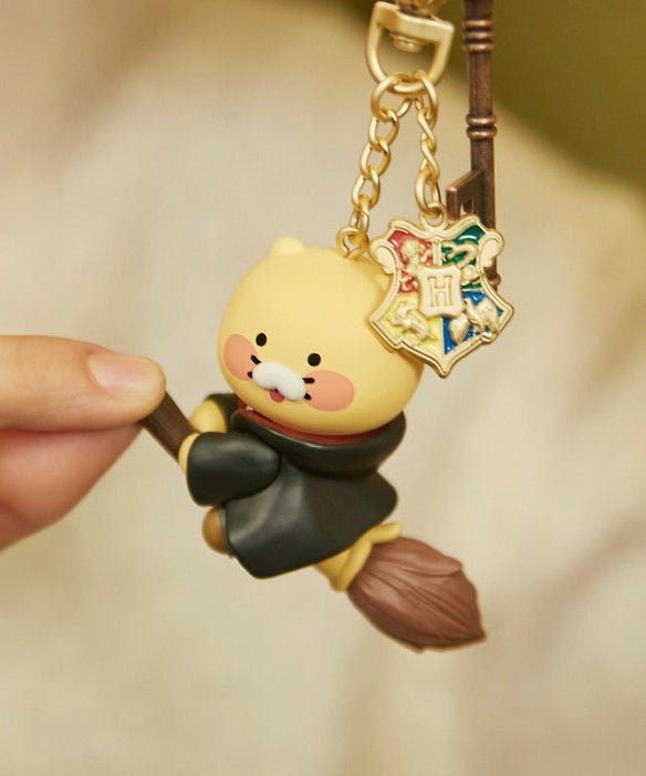 KAKAO FRIENDS Figure Key Ring Choonsik #HarryPotterCollection featuring Choonsik on a broomstick with a Hogwarts emblem charm.