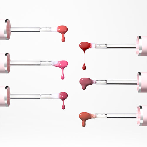Various shades of KEEP IN TOUCH Glow Water Lip Tint dripped from applicators, showcasing vibrant colors and glossy texture.