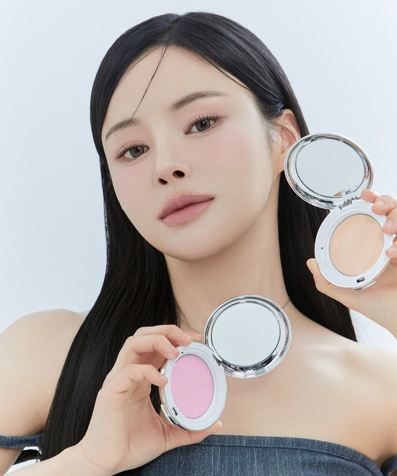 Model showcasing KEEP IN TOUCH Soft Cloud Blur Powder Pact in two shades.
