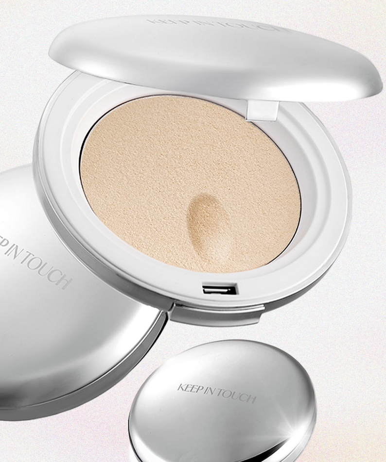 KEEP IN TOUCH Sot Cloud Blur Powder Pact in sleek silver compact case, open to show finely milled powder for a smooth finish. 