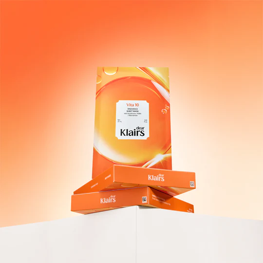 KLAIRS Vitamin Vitality Sheet Mask 25ml 1sheet packaging displayed against an orange background, highlighting product design.