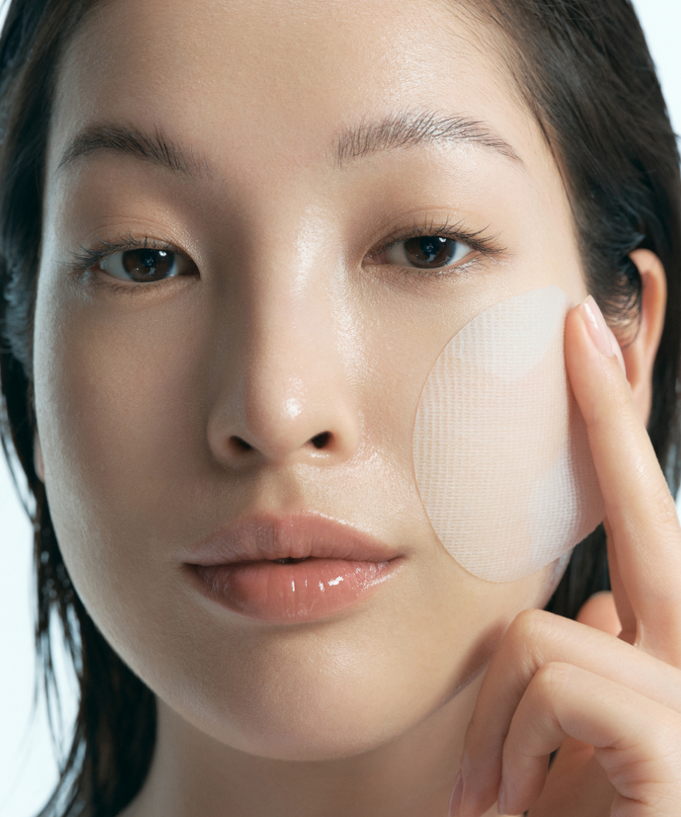 KLAIRS EGF Blue Calming Toner Pads 60 Pads being applied on face for skin soothing and hydration