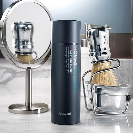 LACVERT Homme Recharge All-in-One Essence 150ml bottle styled on marble counter with shaving brush and mirror — Gentleman Korea