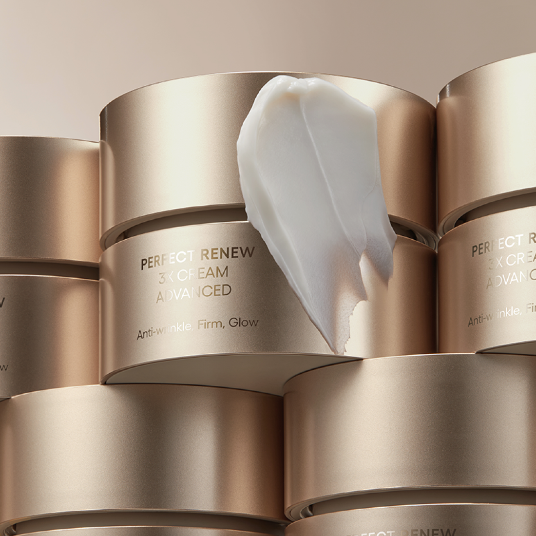 LANEIGE Perfect Renew 3X Cream Advanced 50ml in elegant gold packaging with cream texture displayed on top.
