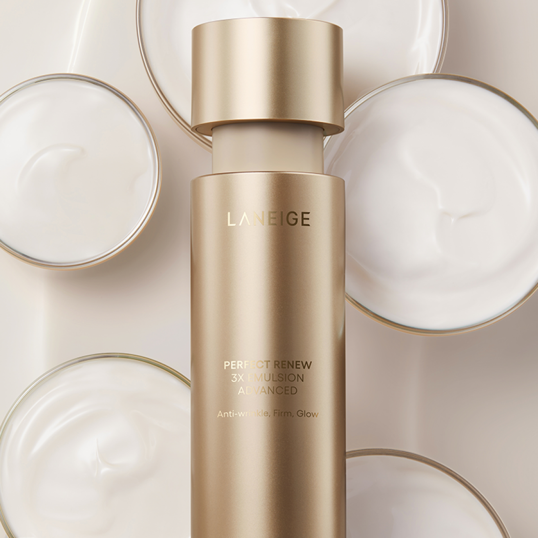 LANEIGE Perfect Renew 3X Emulsion Advanced 130ml bottle on a backdrop of cosmetic creams
