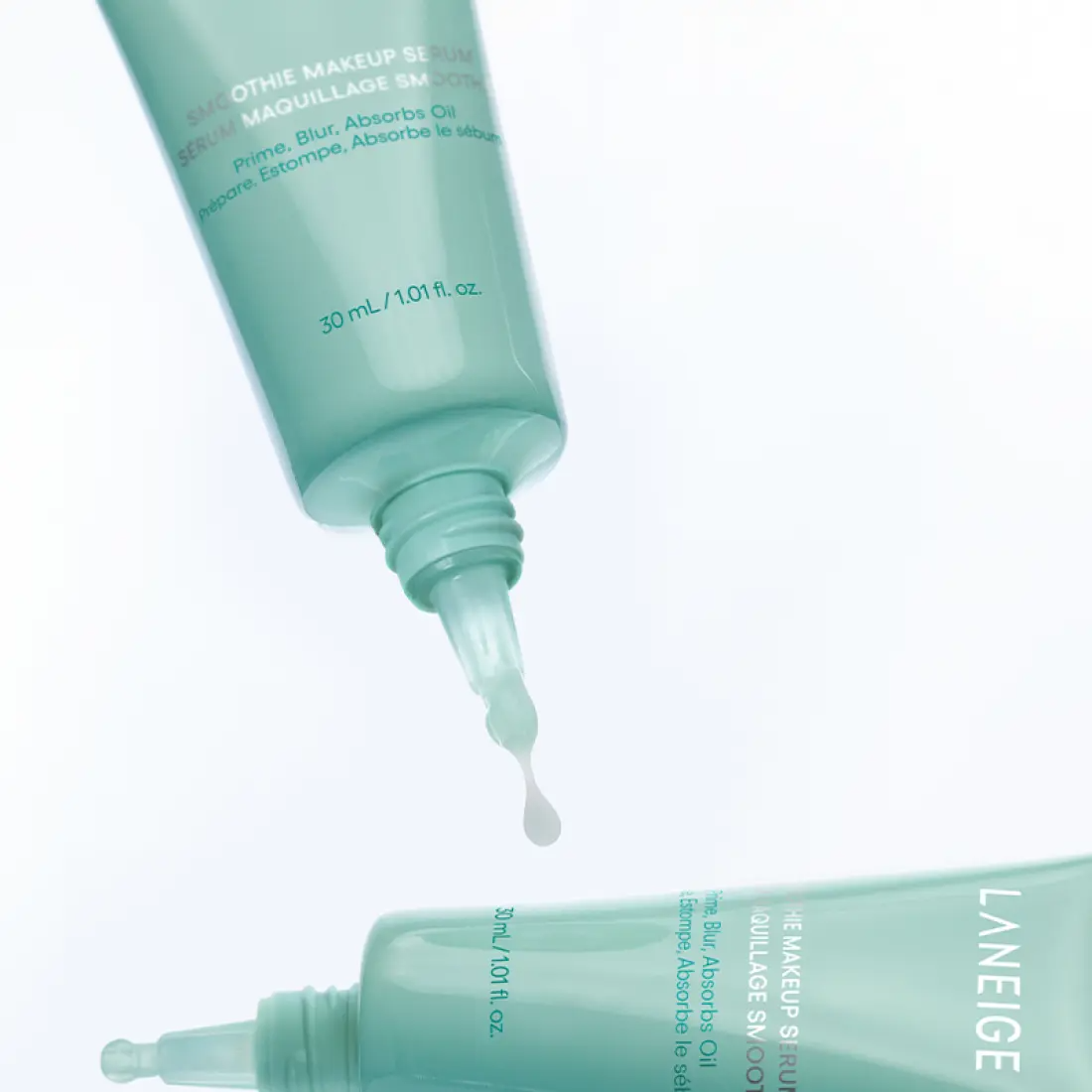 Two tubes of LANEIGE Smoothie Makeup Serum 30ml with visible drop of serum.