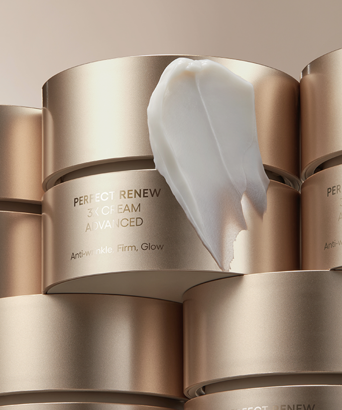 LANEIGE Perfect Renew 3X Cream Advanced 50ml in elegant gold packaging with cream texture displayed on top.