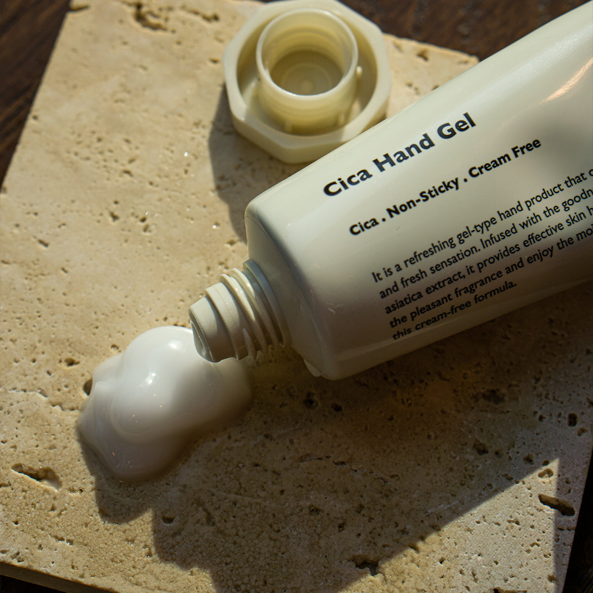 LAZY SOCIETY Cica Hand Gel 50ml tube dispensing gel on textured stone, Gentleman Korea men’s skincare product