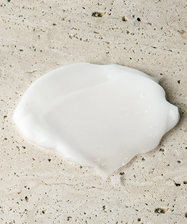 Gentleman Korea product shot of LAZY SOCIETY Cica Hand Gel 50ml cream texture on stone background for men’s Korean skincare