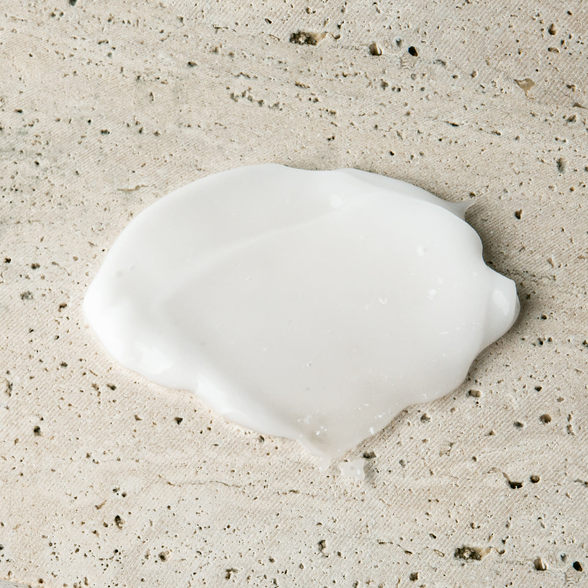 Gentleman Korea product shot of LAZY SOCIETY Cica Hand Gel 50ml cream texture on stone background for men’s Korean skincare