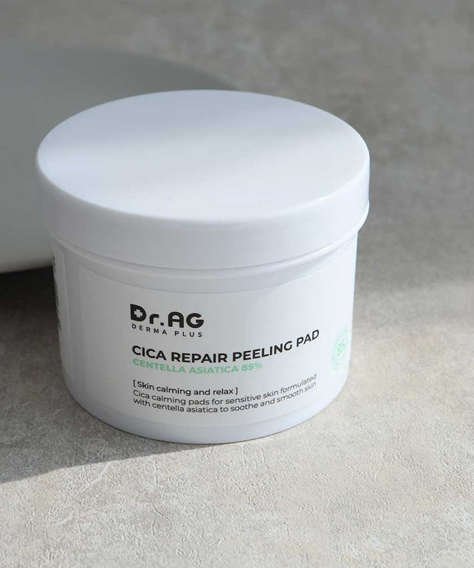 Dr.AG Cica Repair Peeling Pad container with product details and branding, designed for skin calming and repair with Centella Asiatica.