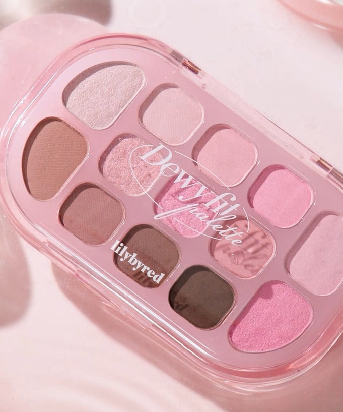 LILYBYRED Dewy Fit Palette showcasing a variety of pink and neutral eyeshadow shades with a glossy finish in a compact case.