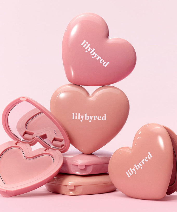 LILYBYRED Love Beam Cheek Balm in heart-shaped compact cases, showcasing the product design and packaging.